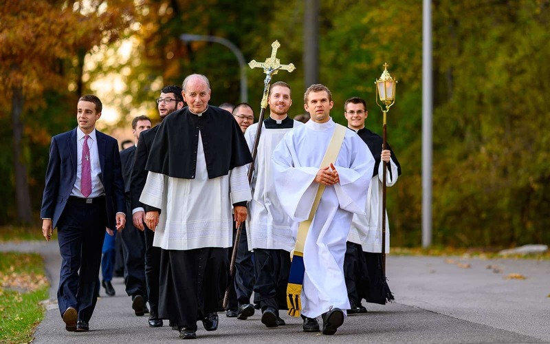 Priests, deacons and seminarians returning from a service.