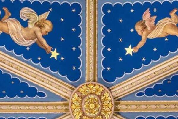 A beautifully painted ceiling with two angels.