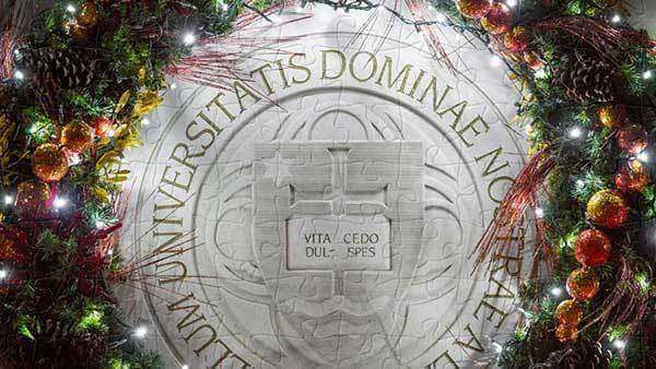 A wreath around the Notre Dame seal.