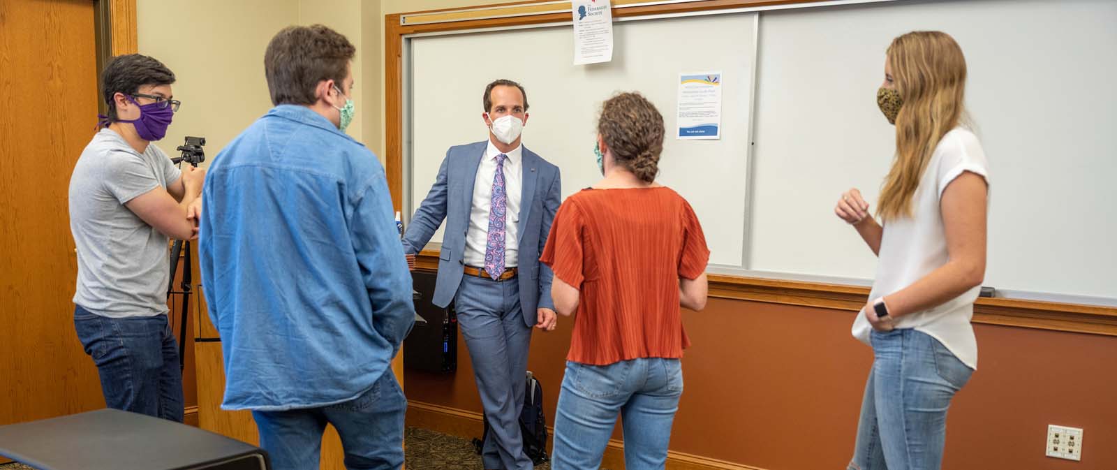 Attorney and co-teacher of the Notre Dame Exoneration Justice Project, Elliot Slosar, chats with law students after class.
