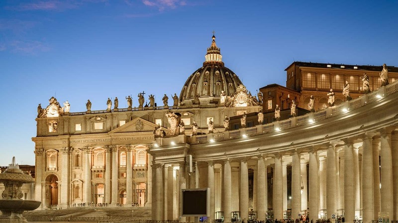 St. Peter’s Basilica lights up at dusk.