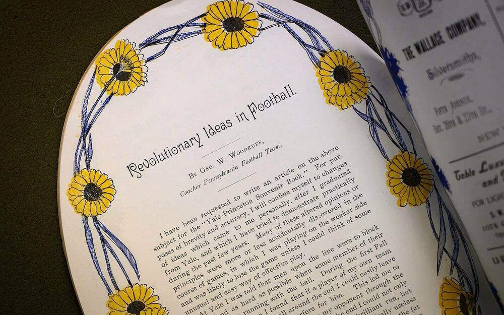 An oval book page outlined with decorative sunflowers. The title of the page says 