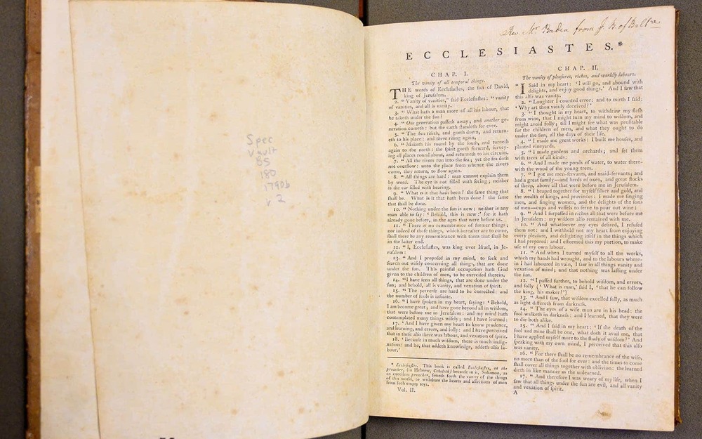 Stephen Badin’s personal bible. The left page is blank with a hand written note in the center.