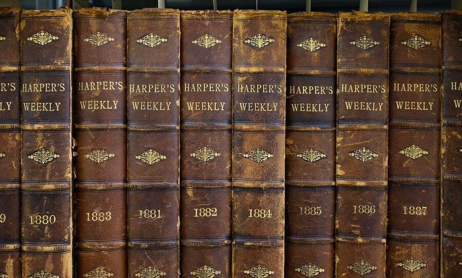 A collection of Harper’s Weekly on a bookshelf.