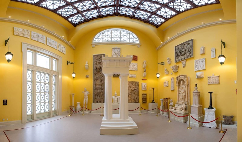 17-foot-high yellow walls of plaster architectural casts that were used to create intricate and elaborate monuments and details for buildings.
