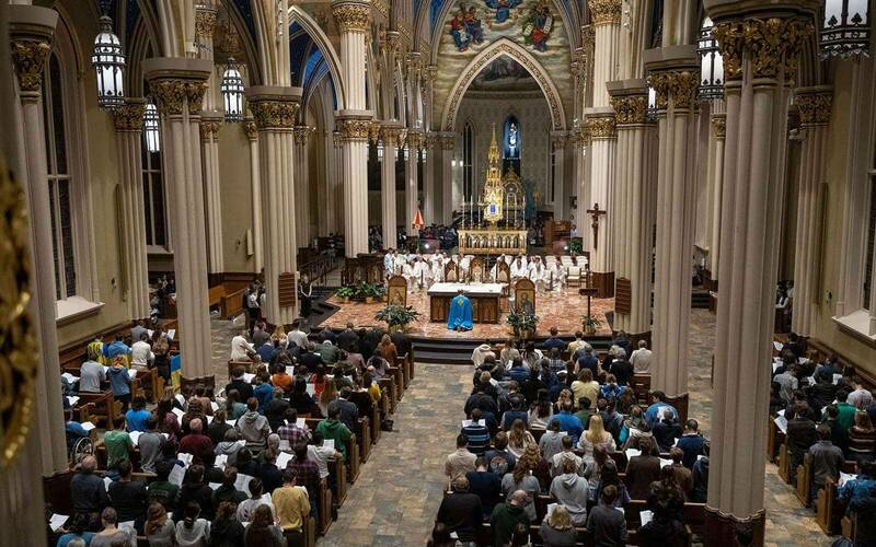 A packed Basilica during a prayer service.