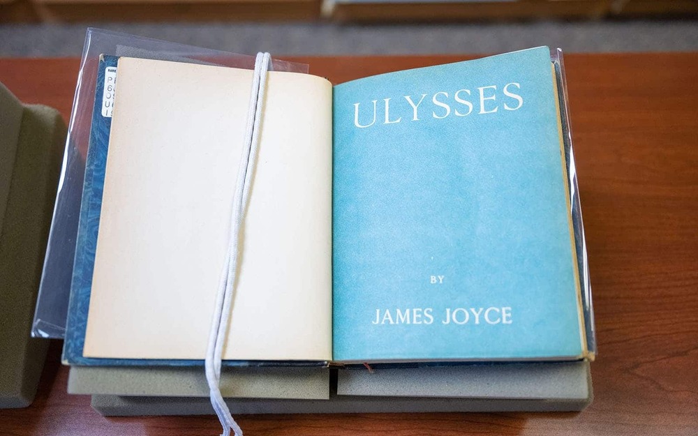 An open book, the title 'Ulysses' on the right-hand side.