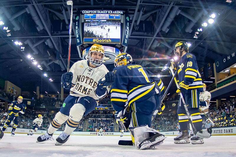 A Notre Dame hockey player celebrates after scoring a goal.