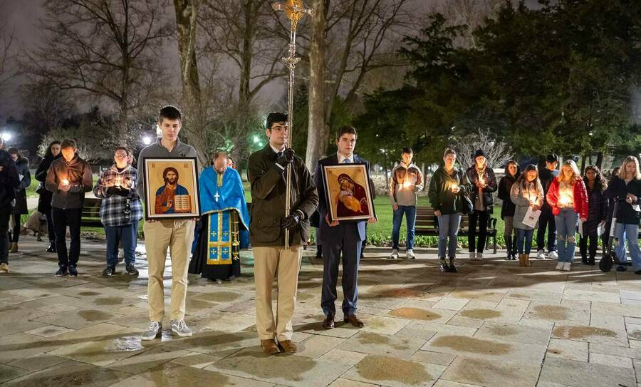 Students pray in front of the Grotto following the vigil for peace in Ukraine at Stanford Hall Chapel. The prayer service was part of a nationwide U.S. Collegiate Student Solidarity Vigil for Ukraine, with over 20 other schools participating.