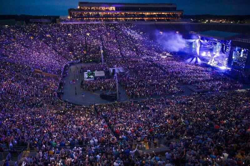 A packed full stadium crowd during a Billy Joel concert.