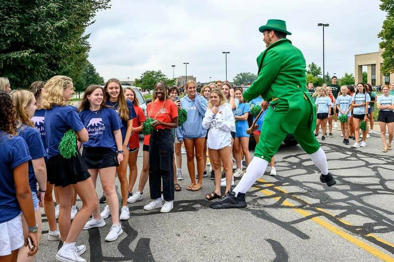The Notre Dame Leprechaun greets first year students as they attend a Women’s Soccer game, Welcome Weekend.